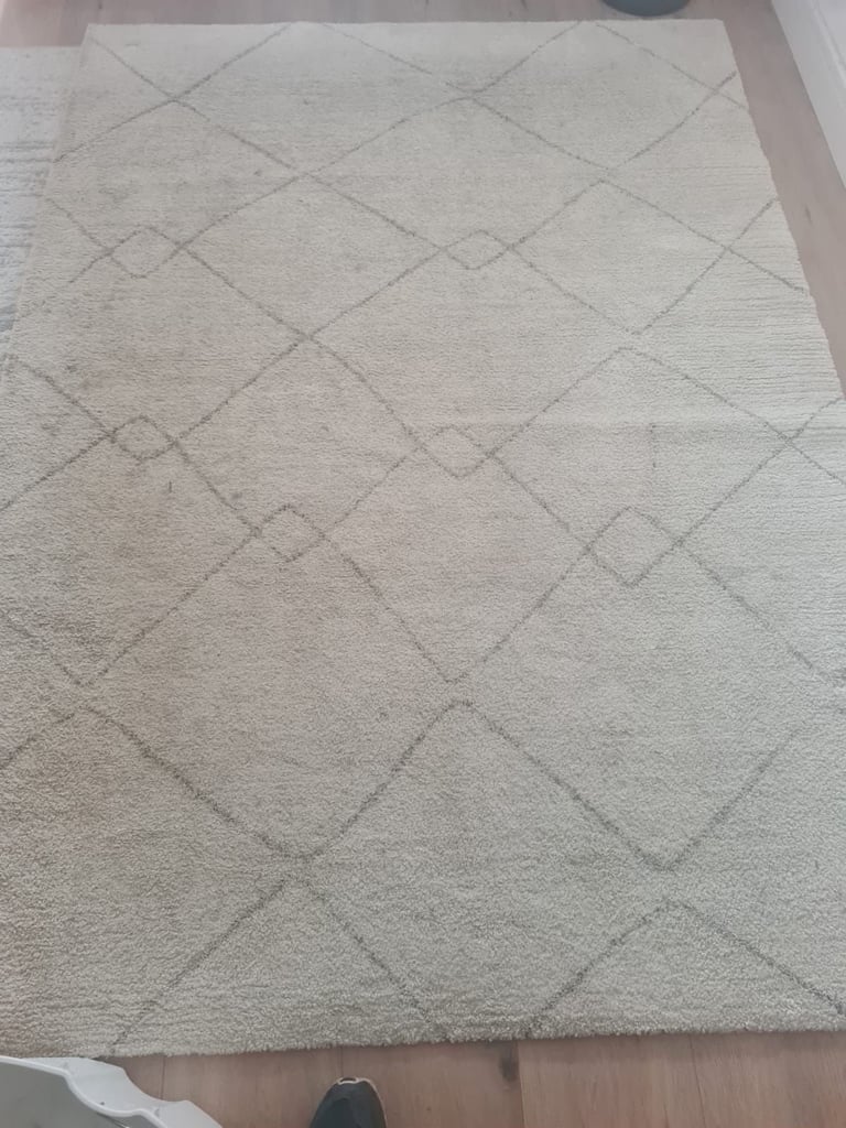 Beige fabric with diagonal quilted diamond pattern design